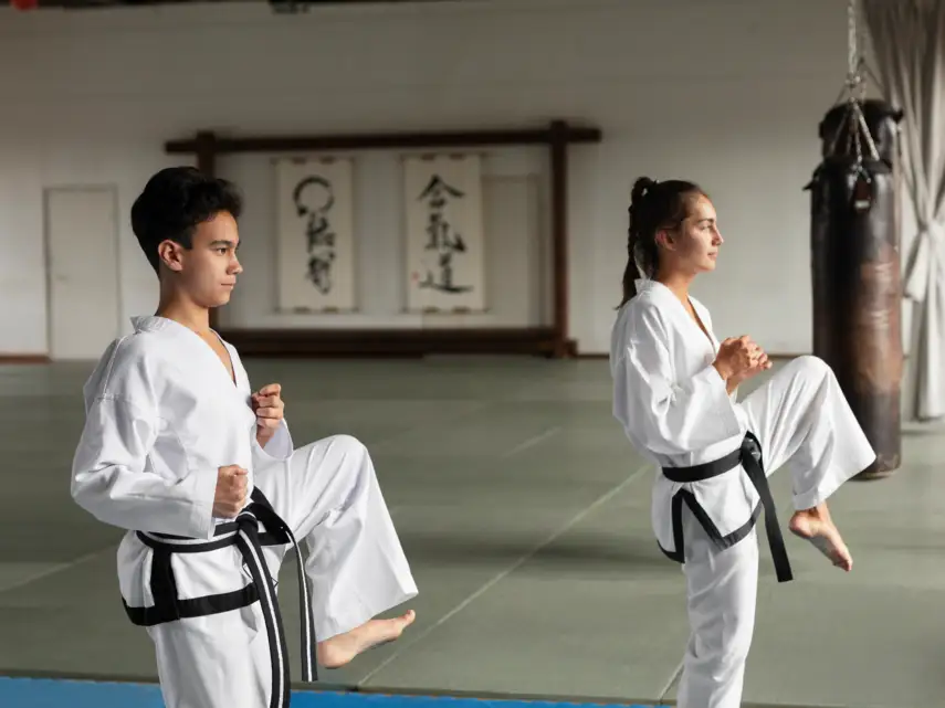 full-shot-asian-people-practicing-taekwondo